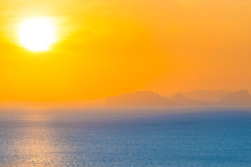 Fototapeta na wymiar Many small islands landscape on sunset sea with colorful sunset sky