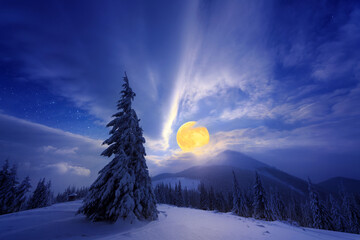 Night winter landscape with full moon in the mountains