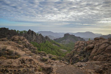 Valley full of mountains and volcanic rocks in Gran Canaria during sunset.