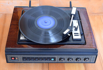 Obraz premium Vintage record player with vinyl disc, close-up.