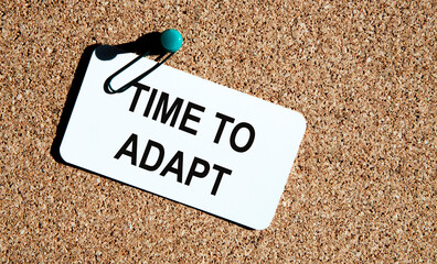 A card with the text TIME TO ADAPT is attached to the comment board,