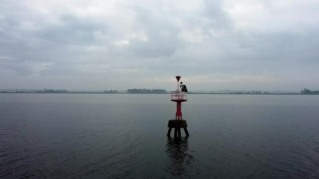 Flying around a light buoy with a drone.