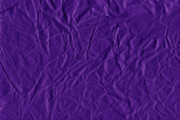 Violet vintage and old looking crumpled paper background. Retro cardboard texture. Grunge paper for drawing. Ancient book page. Present wrapping.