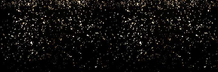 Festive luxury banner - black background with holographic flying golden sparkles for your project. Holiday backdrop with copyspace. Birthday party, Christmas or New Year celebration concept