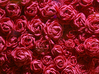 Macro photography of a bouquet of withered red roses. Delicate flowers petals. Natural colorful textured pattern. Concept of sadness and dying, withering