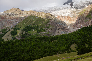 Spielboden and Längfluh cablecar stations in front of the melting Fee Glacier (Feegletscher) and...