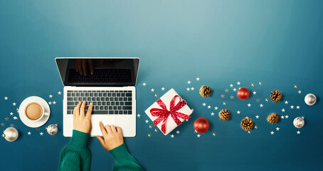 Christmas ornaments with person using a laptop computer - overhead view