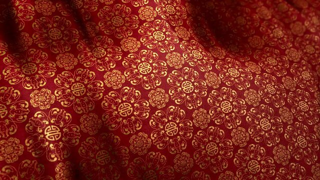 Traditional elegant Asian Double Happiness pattern in golden red color on waving looped cloth. Concept 3D animation shot for Chinese New Year and festive backgrounds. Luxurious full frame silk texture