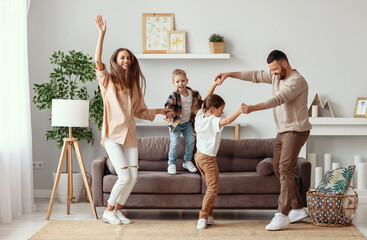 happy family mother father and children dancing at home - obrazy, fototapety, plakaty