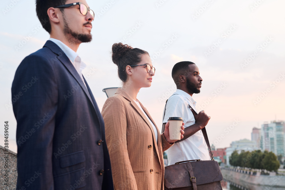 Aufkleber side view of young business partners of various ethnicities standing in row