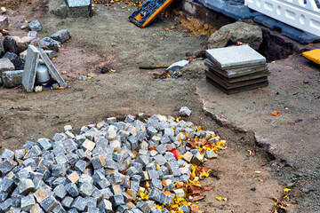 Close-up of road construction site with cobblestones
