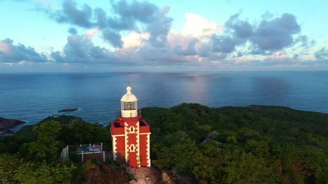 Red lighthouse la caravelle Martinique aerial shot during sunset tropical forest hike