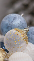 Christmas ball close-up, blurred bokeh background. Christmas background for a postcard. Decoration for a Christmas tree, spruce branches, New Year's ball.
