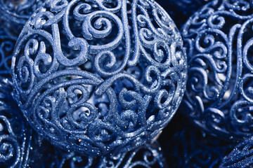 Christmas background with blue ornament balls closeup. Winter holiday xmas and Happy New Year theme.