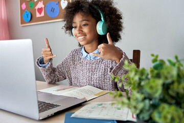 Girl wearing headphones, communicating with sign language.