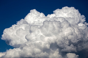 Cumulus clouds in the sunset light. Abstract composition of dramatic sky.