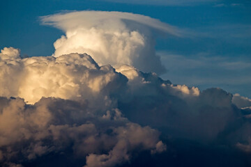 Cumulus clouds in the sunset light. Abstract composition of dramatic sky.