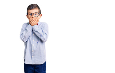 Cute blond kid wearing nerd bow tie and glasses shocked covering mouth with hands for mistake....