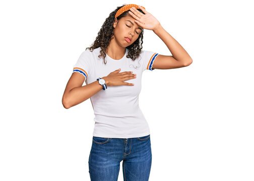 Young african american girl wearing casual clothes touching forehead for illness and fever, flu and cold, virus sick
