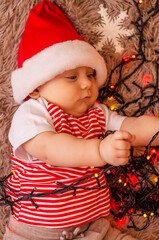 baby in santa hat wish you a merry christmas and happy new year