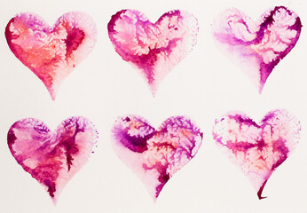 Watercolor painted pink heart, on the white watercolor paper.