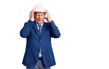 Senior handsome grey-haired man wearing suit and architect hardhat suffering from headache desperate and stressed because pain and migraine. hands on head.