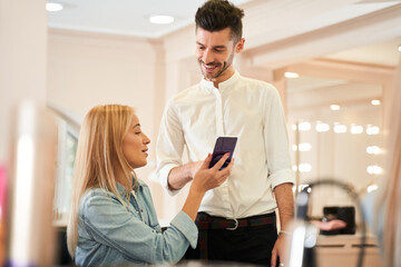 Woman discussing hairstyling with her hairdresser