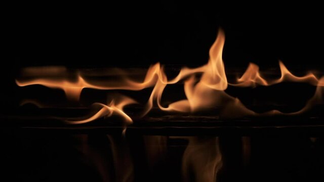 Slow motion. Igniting and burning two parallel lines of fire.
