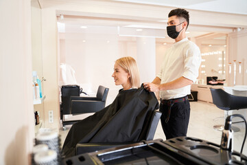 Fototapeta premium Man looking at the reflection of the client