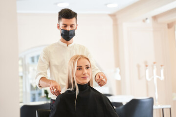 Man looking at his blonde client