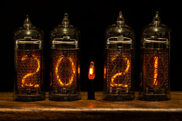 2021, Nixie tube showing 2021, bright red numbers on black background