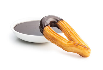 Tasty fried churros with chocolate dip