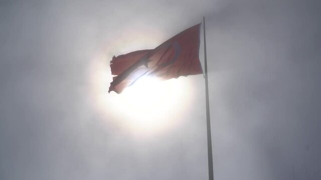 Fantastic view of the waving Turkish flag in fogy sky. TURKEY	