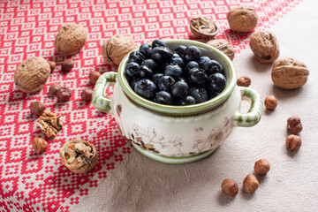 walnuts lie in a wooden dish