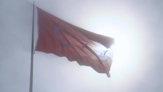 Fantastic view of the waving Turkish flag in fogy sky. TURKEY	