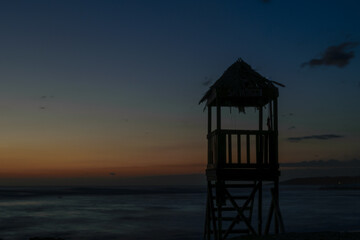 lifeguard tower at sunset
