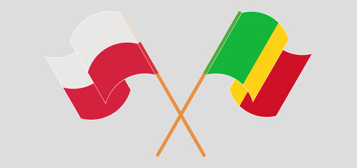 Crossed and waving flags of Mali and Poland