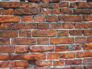 Old red brick wall. Ancient 
fortress wall texture