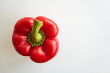 Top view of red pepper on white background with copy space