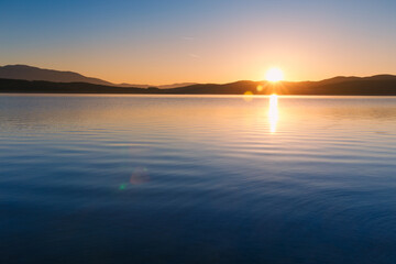 Spectacular sunrise scene over lake in Bulgaria. Amazing sunset/sunise landscapes.