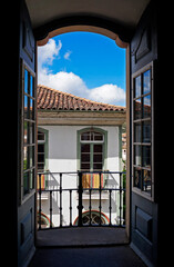 Colonial balcony door with view of Ouro Preto, historical city in Brazil