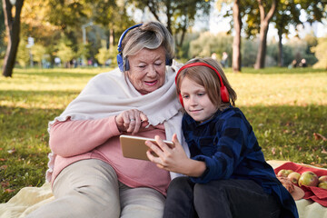 Woman looking music videos at the smartphone