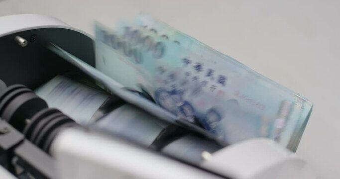 Money counter machine counting New Taiwan dollar