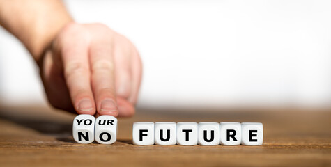Hand turns dice and changes the expression "no future" to "your future".