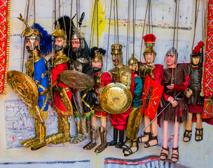 Raw of traditional sicilian puppets with metal knight armor
