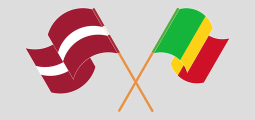 Crossed and waving flags of Mali and Latvia