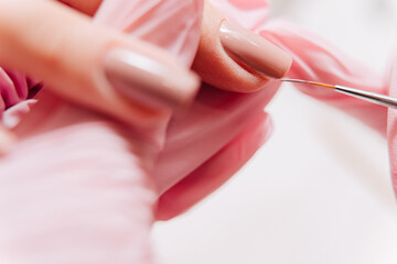 Obraz na płótnie Canvas Manicure process. Manicurist paints fingernails. Nail polish.