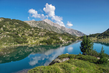 Fototapeta na wymiar Hiking to Banderitsa lakes, view across the lakes of the Pirin Mountains in Bulgaria with Muratovo, Ribnoto, National Park Pirin