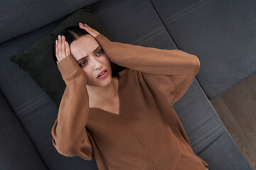 Lady thinking what to do about her problem