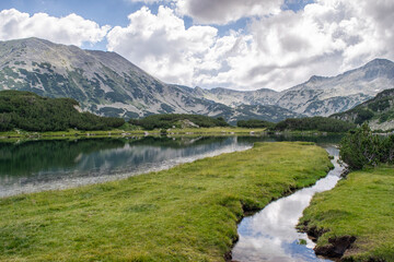 Fototapeta na wymiar Hiking to Banderitsa lakes, view across the lakes of the Pirin Mountains in Bulgaria with Muratovo, Ribnoto, National Park Pirin